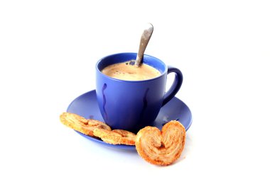 Cup of coffee with milk and cookies isolated over white backgro