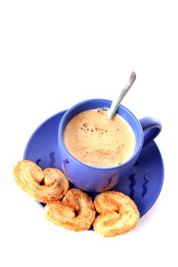 Cup of coffee with milk and cookies isolated over white backgrou