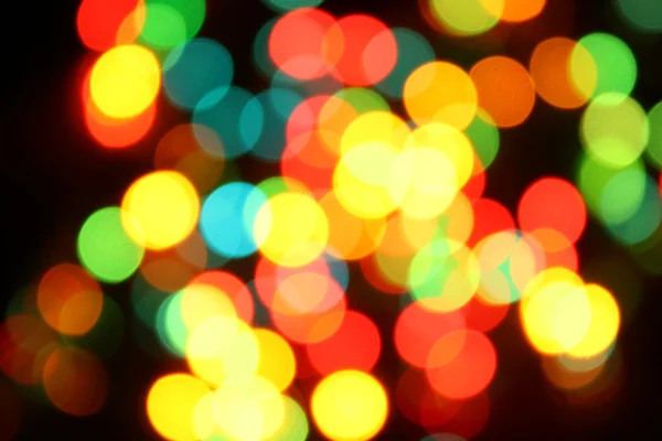 Color christmas lights on the tree — Stock Photo, Image