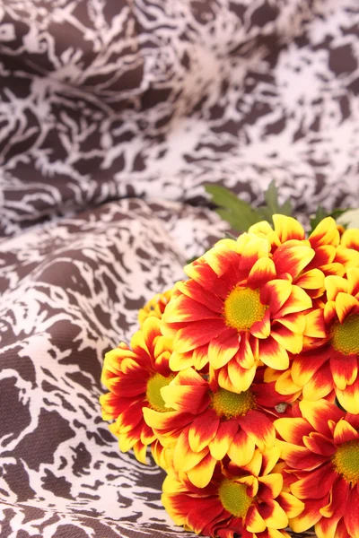 Bunch of flowers on the textile — Stock Photo, Image