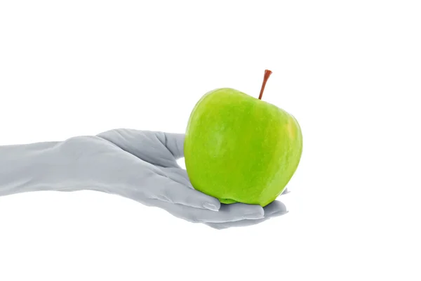手里拿着用白色隔开的绿色苹果 — 图库照片