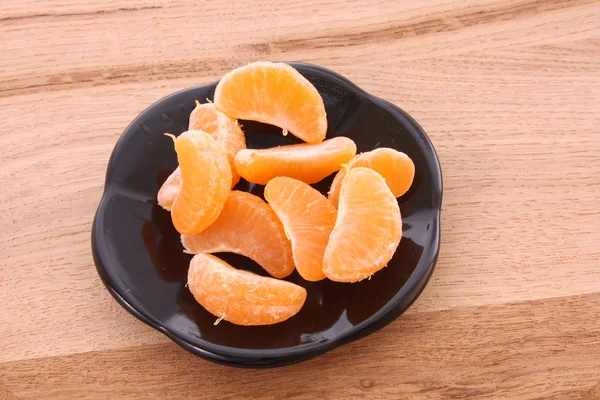 Fresh mandarin isolated on wooden background — Stock Photo, Image