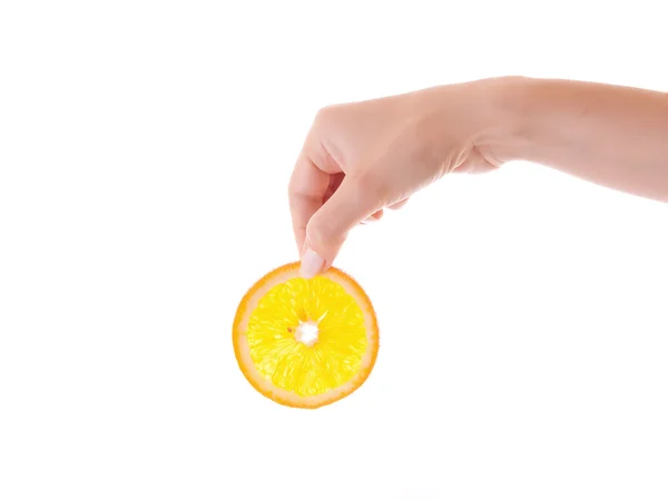 Narancs szelet a kezében — Stock Fotó