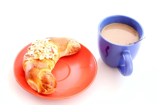 Buns and cup of coffee on white — Stock Photo, Image