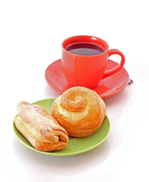 Buns e xícara de chá em branco — Fotografia de Stock