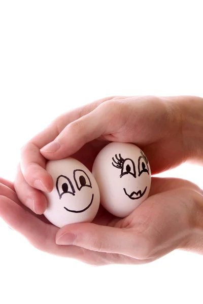 Dwa jaja w ręce na białym tle — Zdjęcie stockowe