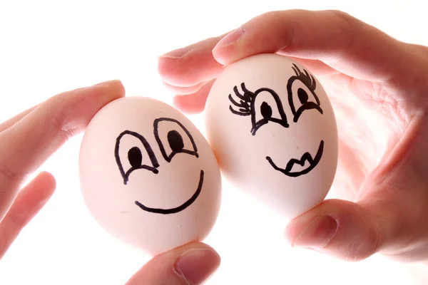 Tre ägg i händer isolerad på vit — Stockfoto