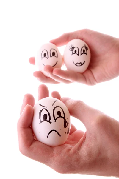Tre uova in mani isolate su bianco — Foto Stock