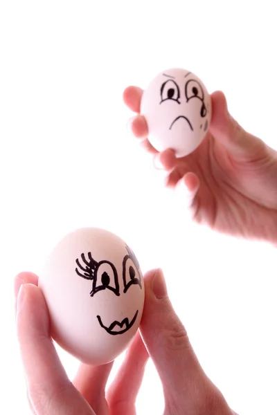 Tři vejce v rukou izolovaných na bílém — Stock fotografie