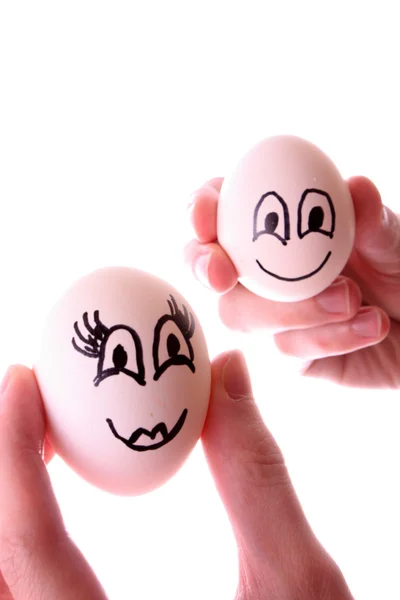 Beyaz izole elinde iki yumurta — Stok fotoğraf
