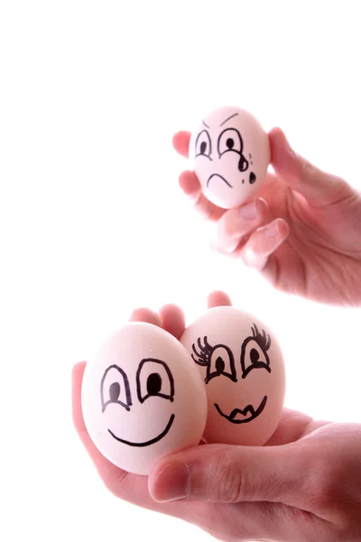 Ovos em mãos isoladas em branco — Fotografia de Stock