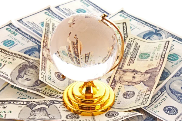 Glass globe and many dollars — Stock Photo, Image