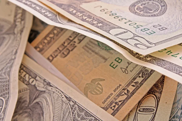 Bakgrund med amerikanska dollar av papper räkningar — Stockfoto