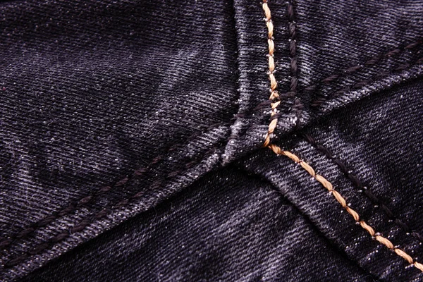 Dark fabric texture close-up of jeans — Stock Photo, Image