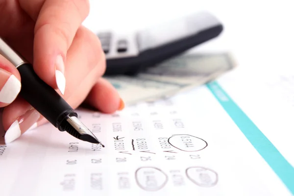 Hand with pen calculate income — Stock Photo, Image