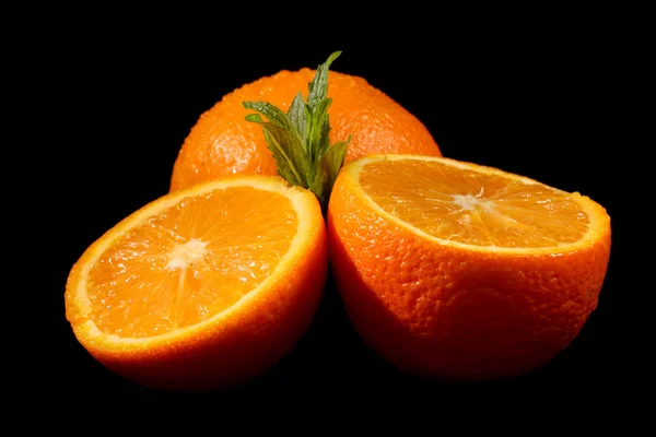 Sliced orange on black background — Stock Photo, Image