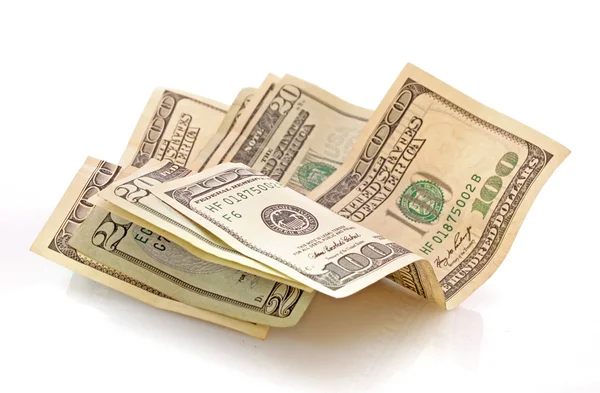 Notas de dólar em um fundo branco — Fotografia de Stock