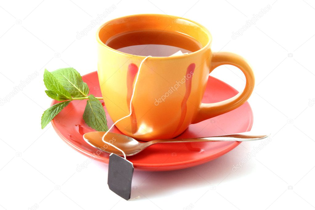 Tea bag in cup with mint