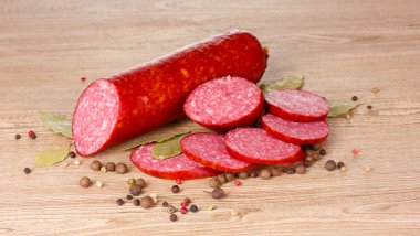 Tasty sausage and spices clipart