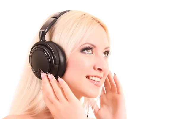 Beautiful young blonde woman with bright make-up listening music — Stock Photo, Image