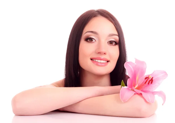 Beautiful young woman with lily flower on blue background — Stock Photo, Image