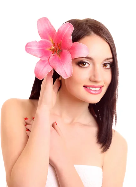 Schöne junge Frau mit Lilienblüte — Stockfoto