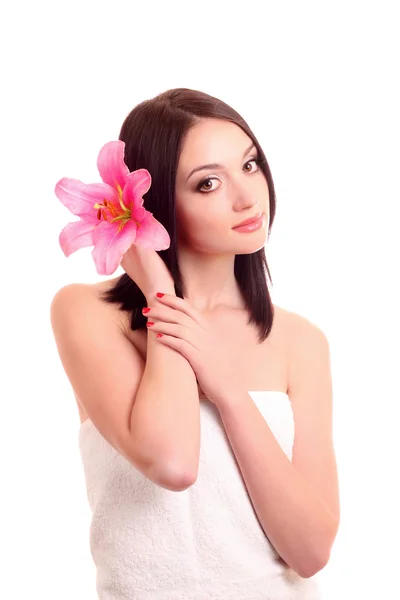 Красивая молодая женщина с цветком лилии — стоковое фото