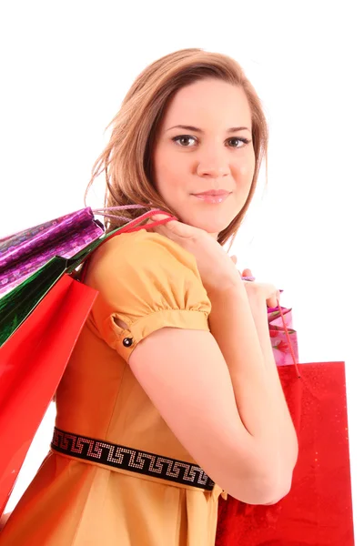 Mulher bonita com sacos de compras a cores na mão. Isol. — Fotografia de Stock