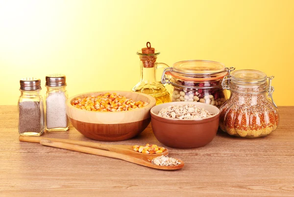 Grains in pots and spoons — Stock Photo, Image
