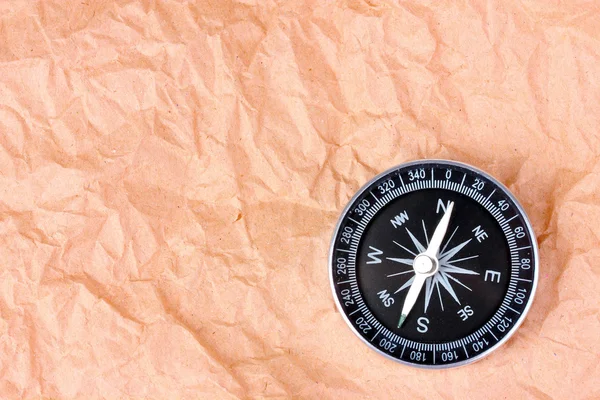 Kompass på papper bakgrund — Stockfoto