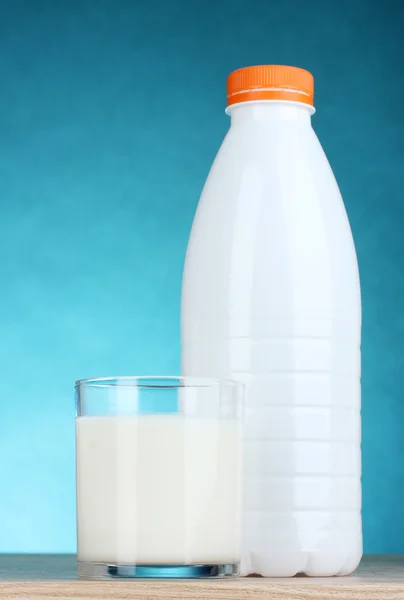 Tasty milk in glass and bottle — Stock Photo, Image
