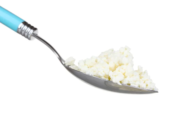 Tasty cottage cheese in spoon — Stock Photo, Image