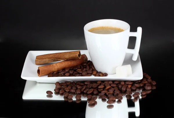 Cup of coffee, coffee beans and cinnamon — Stock Photo, Image