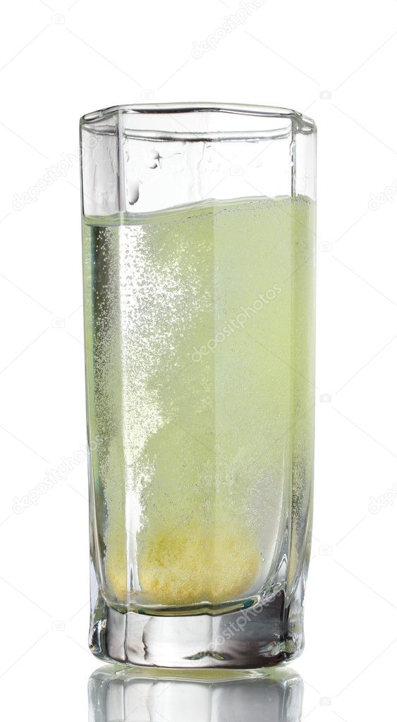 Glass with tablet in water with bubbles
