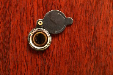 Peephole on wooden door clipart