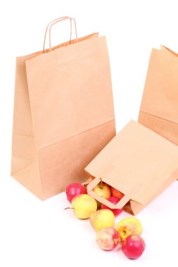 Shopping brown gift bags and apple isolated clipart