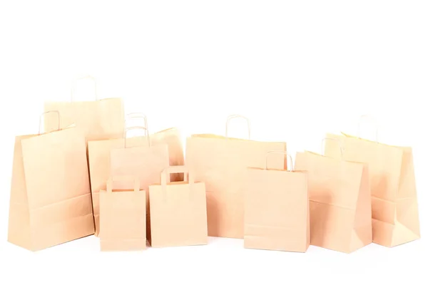 Winkelen bruin geschenk zakken geïsoleerd — Stockfoto