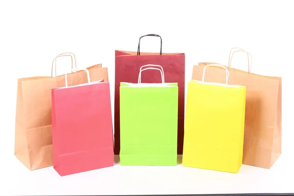 Compras sacos de presente marrom fundo — Fotografia de Stock