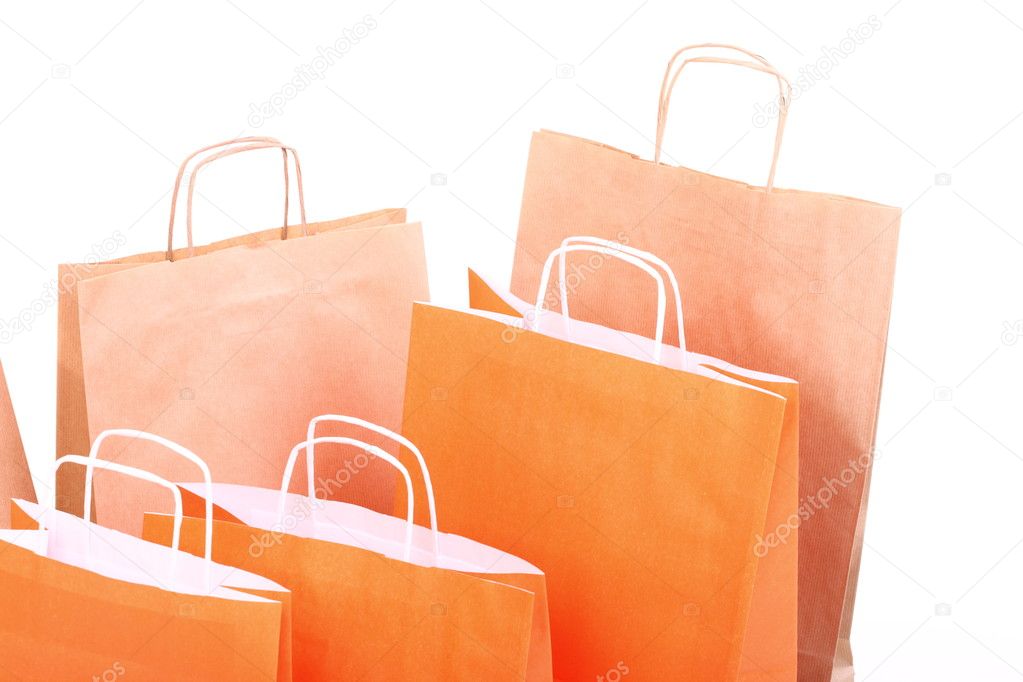 Shopping ORANGE gift bags isolated