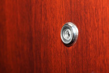 Peephole on wooden door clipart