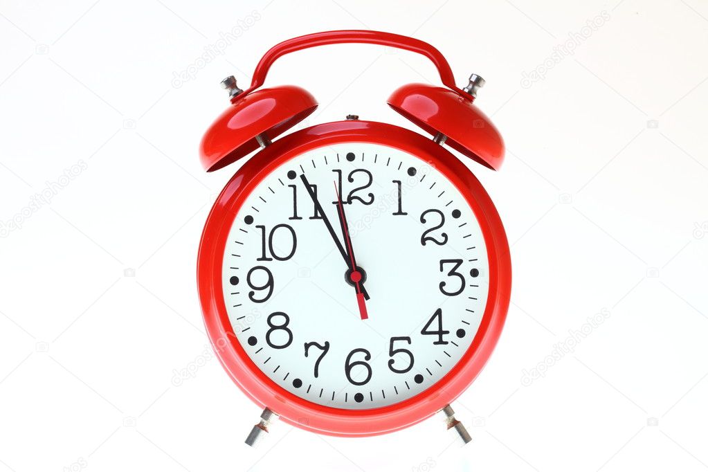 Red old style alarm clock isolated
