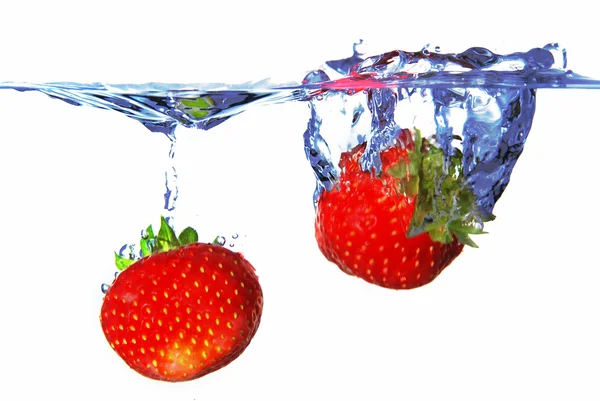 Two strawberries in the water — Stock Photo, Image