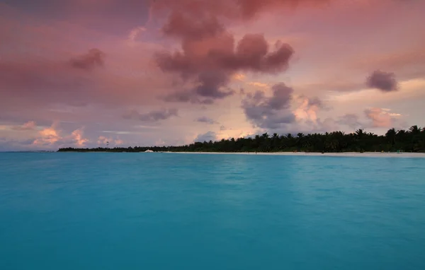 Sunset and atol — Stock Photo, Image