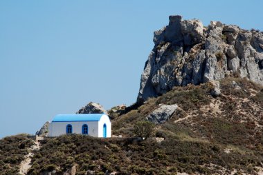 Romantic Greek wedding chapel and a mountain clipart