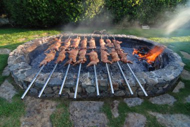 Suckling pig on a grill clipart