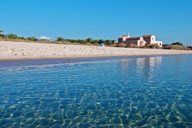 Tropical beach and a church clipart