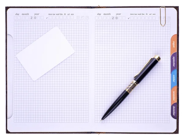 Caderno, caneta e clipe de papel — Fotografia de Stock