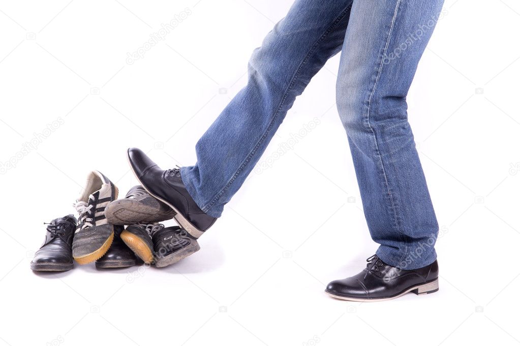 A man pushes an old shoes