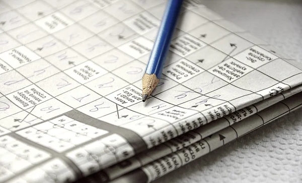 Close up of crossword and pencil — Stock Photo, Image