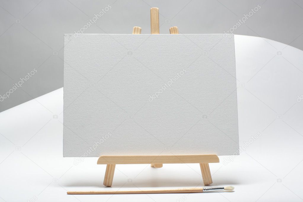 Blank canvas on easel isolate on white background